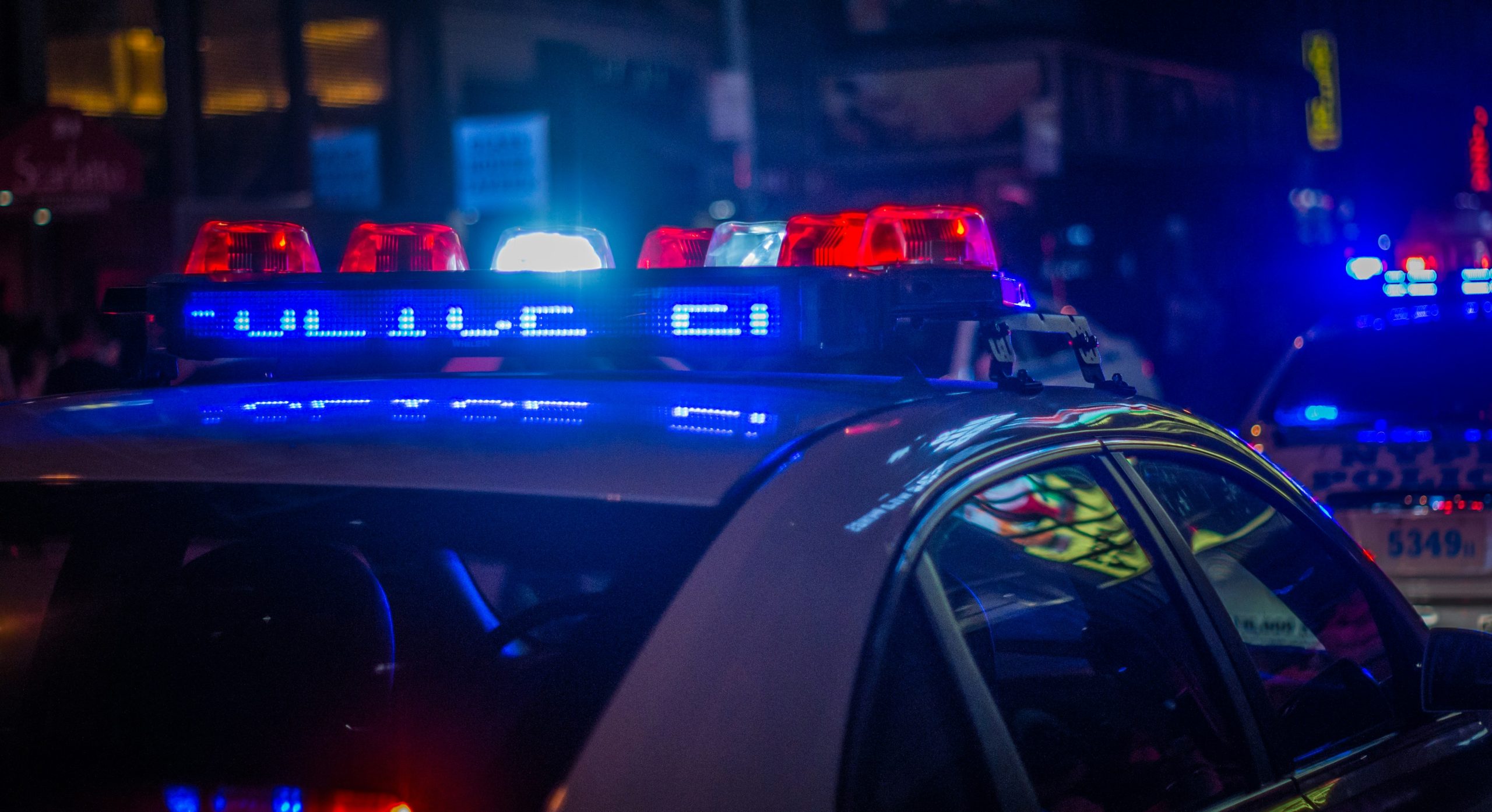 Police vehicle with emergency lights at night